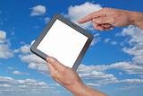 Tablet in hand against the sky.