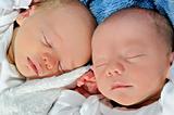 Adorable twins sleeping together