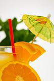 refreshing orange drink with a straw and umbrella