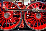 Two large red wheels of the old steam locomotive