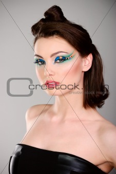 young beautiful woman with makeup in black dress