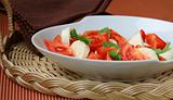 Traditional Italian Caprese salad mozzarella with tomatoes and basil