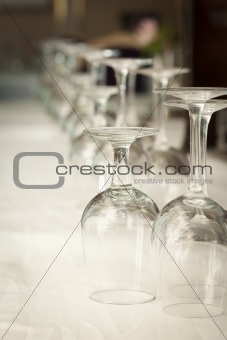 Several Drinking Glasses Abstract in Formal Dining Room Setting.