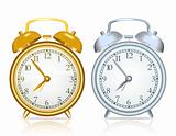 Gold alarm clock and silver alarm clock on white background