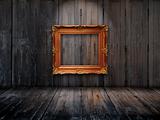 Old picture frame on wooden wall