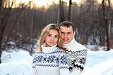 Happy pair in winter forest