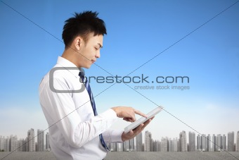 young businessman holding touch pad tablet pc