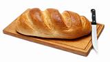 bread with knife on breadboard