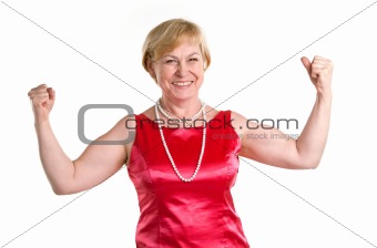 Portrait of fit senior woman flexing her biceps