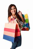 Happy young woman on shopping spree