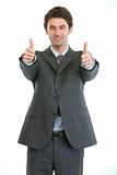Modern businessman showing thumbs up