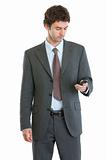 Modern businessman checking mobile phone