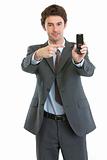 Modern businessman pointing on cell phone