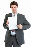 Modern businessman pointing on blank paper sheet