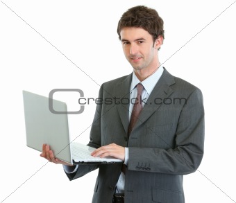 Modern businessman with laptop