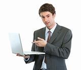 Surprised businessman pointing in laptop