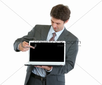 Modern businessman pointing in laptop