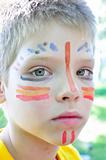 boy with football paintings on face
