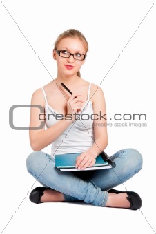 Young woman carrying notebooks in her arms