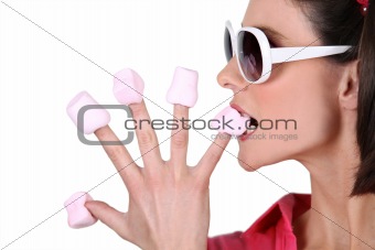 Woman biting in marshmallow