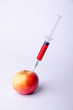 syringe into apple