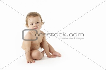 Studio Portrait Of Baby Boy Sitting