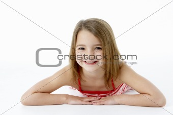 Young Girl Lying On Stomach In Studio