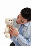Salesman holding a teddy bear
