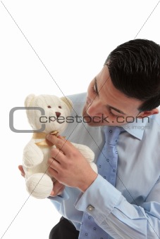 Salesman holding a teddy bear