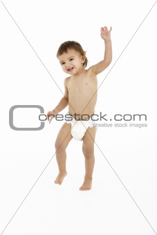 Studio Portrait Of Baby Boy Standing