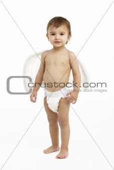 Studio Portrait Of Toddler Wearing Nappy And Angel Wings