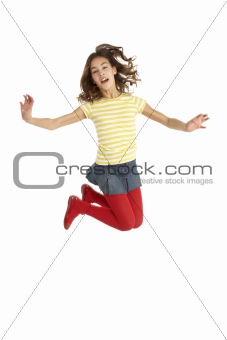 Mid Air Studio Shot Of Young Girl Jumping In Air