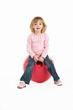Young Girl Having Fun On Inflatable Hopper