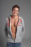 Studio Portrait Of Sexy Young Man Wearing Hooded Sweat Top