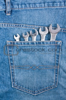 Blue jeans pocket with wrenches 