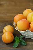 Group ripe juicy fruit apricot on a wooden table, rustic style