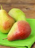 three ripe juicy pear on a wooden table