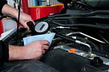 a man repairing a car engine