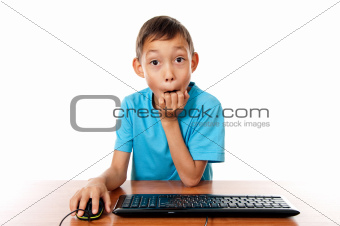 boy sitting in front of computer