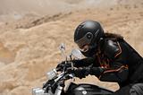 A motorcyclist in a desert