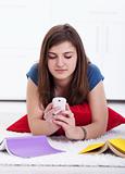 Teenager texting instead of learning