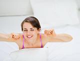 Woman stretching after awake