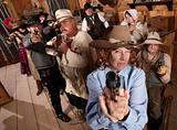 Group of Cowboys Point Guns in Bar