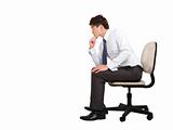 businessman thinking and sitting on the office chair