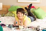 Teenage Girl In Untidy Bedroom