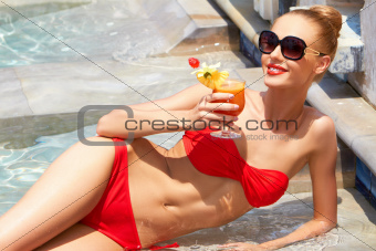 Sweet smile on a gorgeous woman in a small bikini