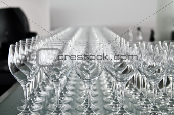 A lot of wine glasses in a row