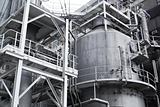 Pipes, tubes, machinery and steam turbine at a power plant 