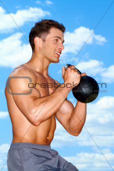 Muscular man working with weights