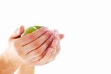 Female hands with nice manicure and apple